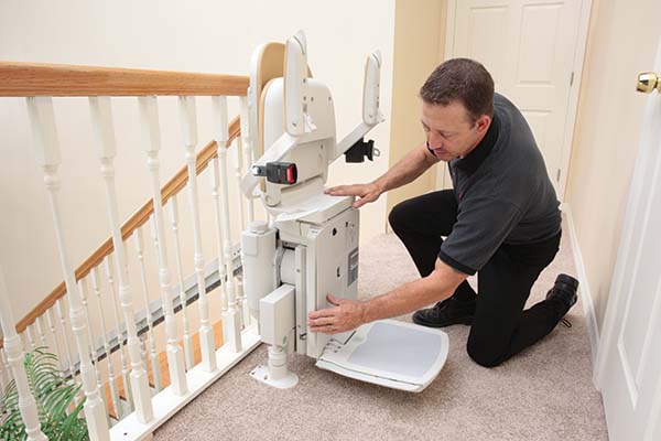 Man inspecting an stairlift